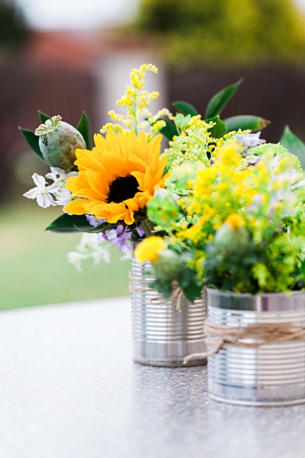 image of tin cans repurposed as planters 