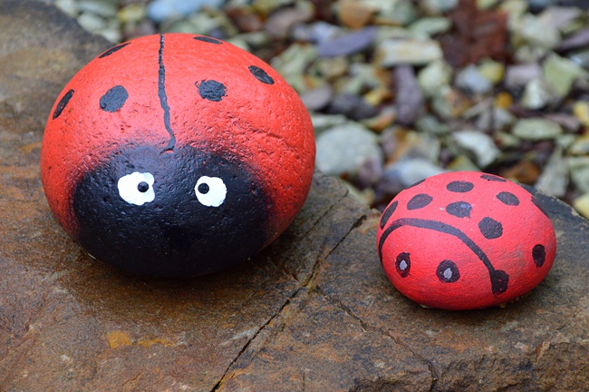 image of painted ladybirds kids art to to outside on patio