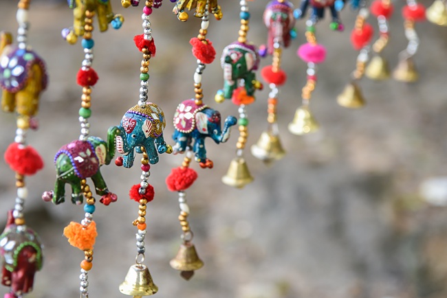 image of windchimes add peaceful relaxation element to concrete patio space 