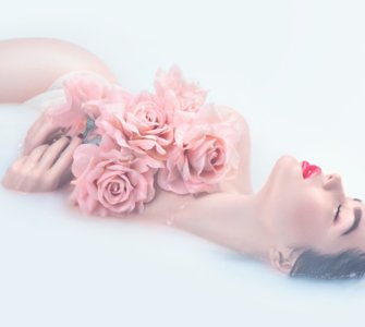 image of woman in bath with roses best organic rose water brand