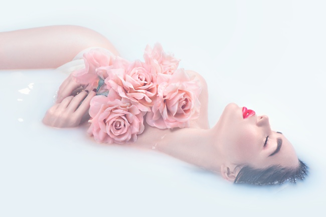 image of woman in bath with roses best organic rose water brand