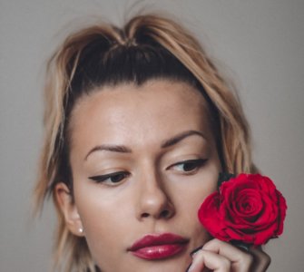 image of woman with rose rose water spray skin