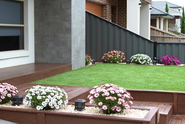 front garden with pebbles and planters